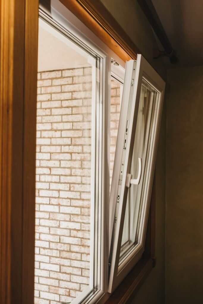 White tilt turn window opened inward in tilt ventilation mode