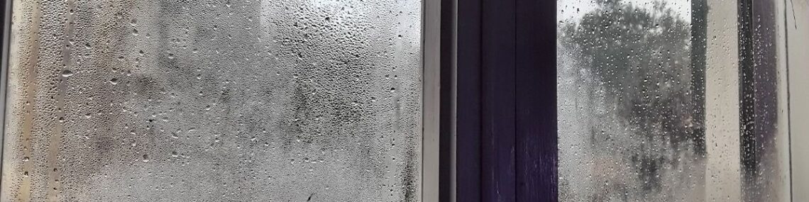 Heavy interior window condensation showing moisture buildup on glass